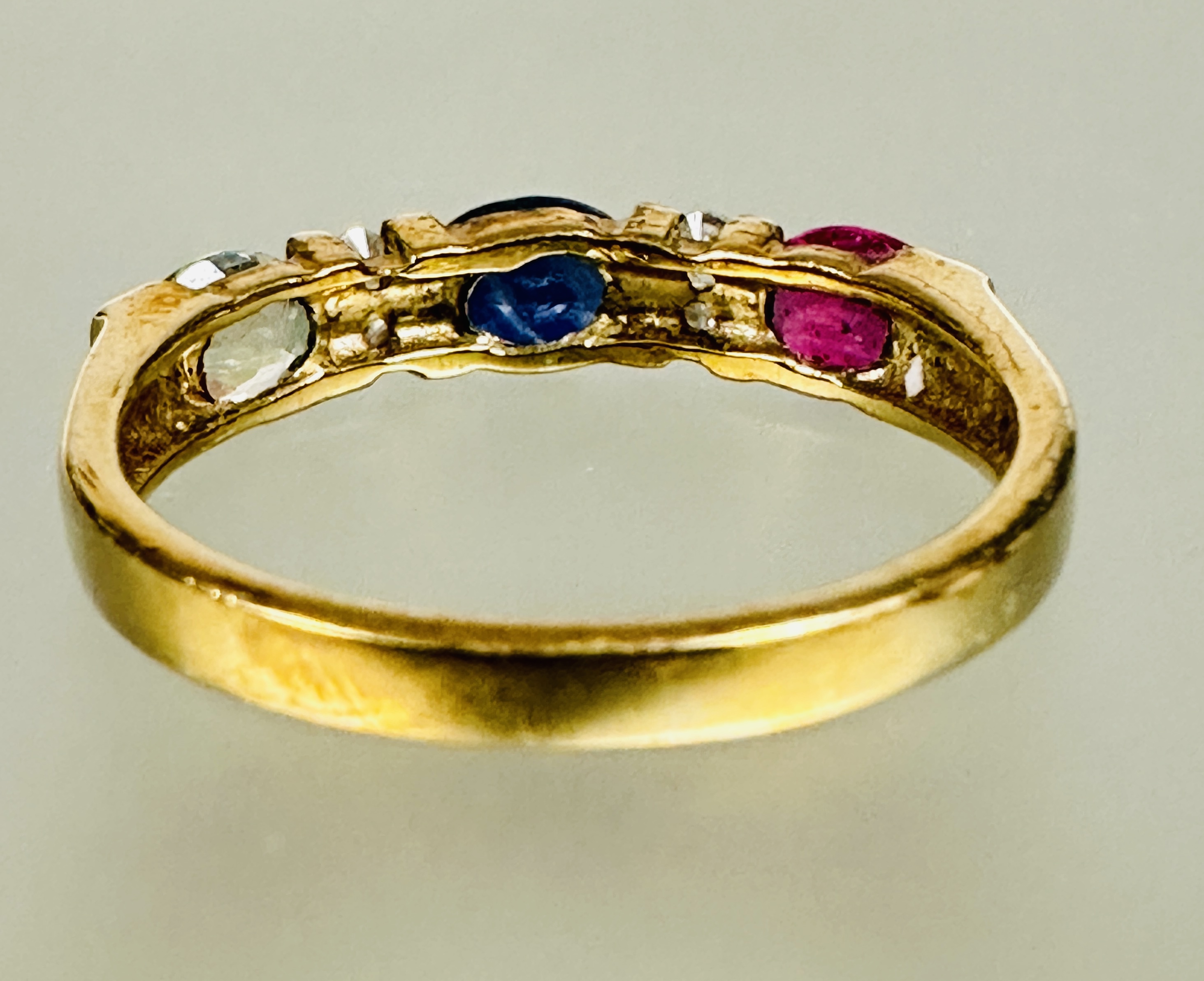 A 9ct gold three stone ring set central oval sapphire flanked by two diamond spacers and a oval - Image 2 of 2