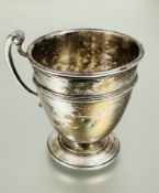 A Edwardian London silver tapered christening cup with C scroll handle to side and engraved with