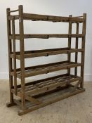 A 19th century slatted pine bakers / cobblers rack of five tiers. H134cm, W133cm, D37cm.