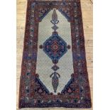 A 20th century Persian Serab rug, hand knotted, the beige field with pole medallion and bordered