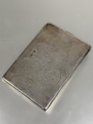 A white metal cigarette case with engraved map of the Denmark and coast line the interior with