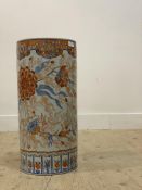A large Chinse cylindrical porcelain stick stand, decorated with floral designs in cobalt blue and
