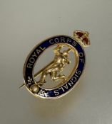 A 9ct gold oval Royal Corps of signals enamel badge L x 3cm 3.6g