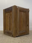 A pedestal cupboard, constructed from pitch pine, ash and other woods, with panelled door