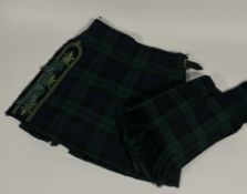 A Gents kilt and matching trousers together with black watch kilt (rosettes to vertical hem) and