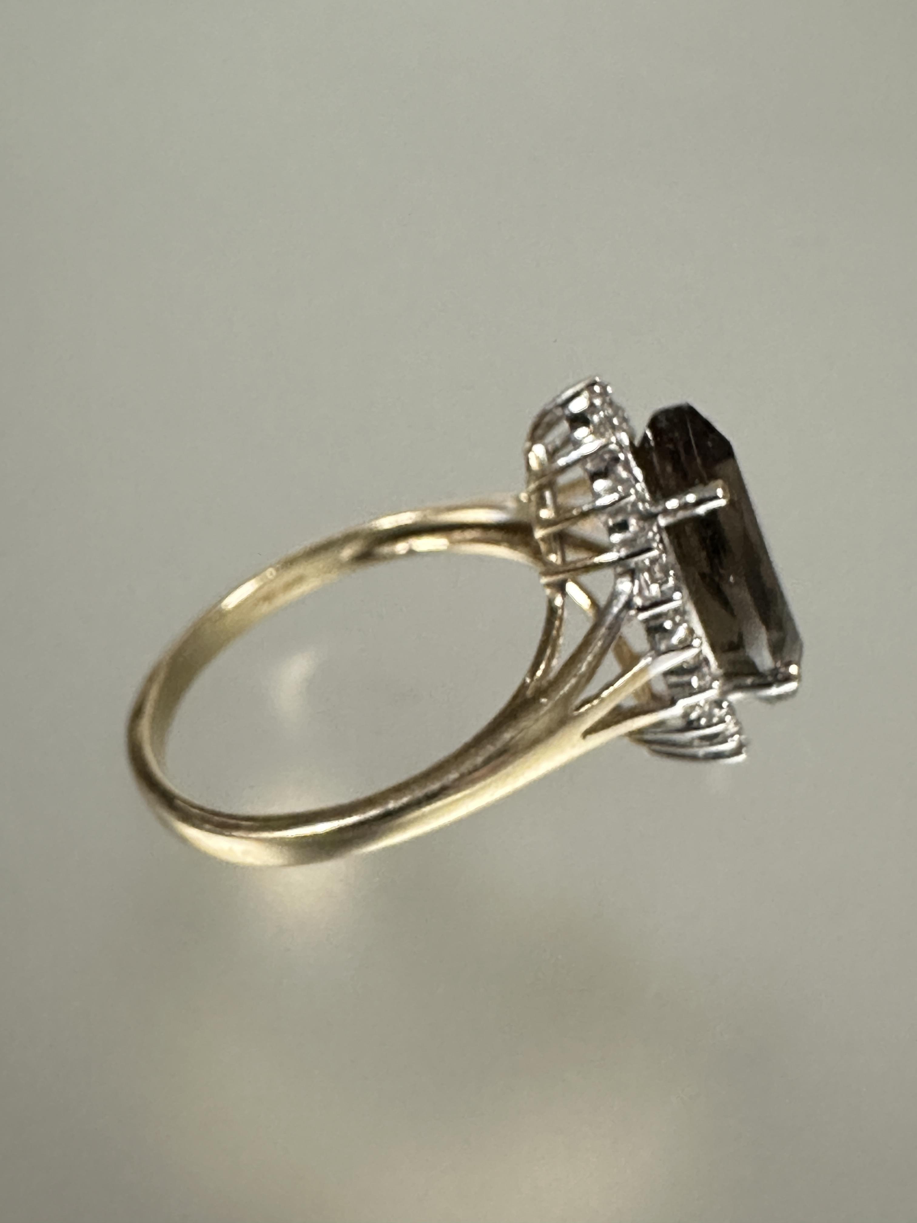 A 9ct gold dress ring set navette shaped cairngorm enclosed within a cz border S 3.57g - Image 2 of 3