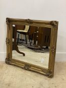 A traditional gilt composition framed wall hanging mirror 77cm x 66cm.