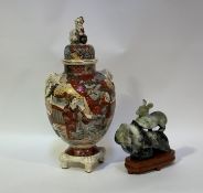 A 20th Japanese Satsuma vase and cover, decorated with traditional scene figures to body with twin