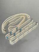 Two cultured pearl bead necklaces one with five turquoise beds flanked by paste set roundels and
