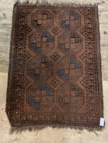 An antique  Bokhara red ground rug decorated with two rows of gulls.