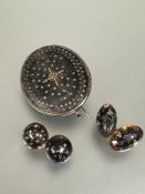 A 19thc tortoise shell oval pique ware brooch L x 4cm section to side damaged and a pair of circular