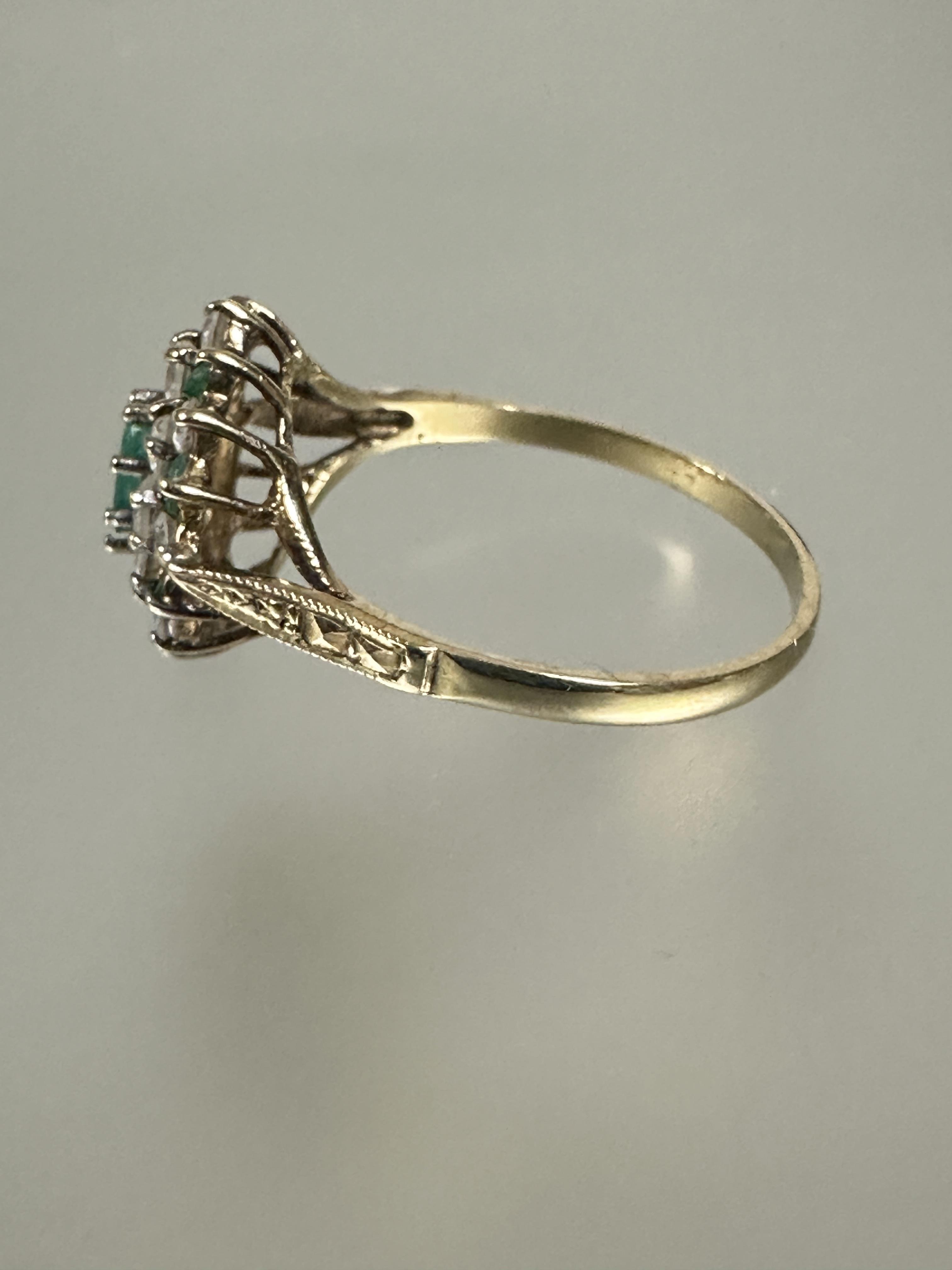 A 9ct gold emerald and cz cluster ring with oval central emerald and outer border of eight - Image 2 of 3