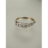 A 9ct gold white stone graduated ring set in platinum N 1.78g