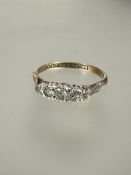 A 9ct gold white stone graduated ring set in platinum N 1.78g