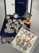 A box containing a collection of seventeen gold plated Westminster commemorative mint coins and