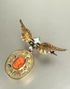 A Edwardian 15ct gold winged brooch with enamel fleur de lis set three seed pearls with engraved