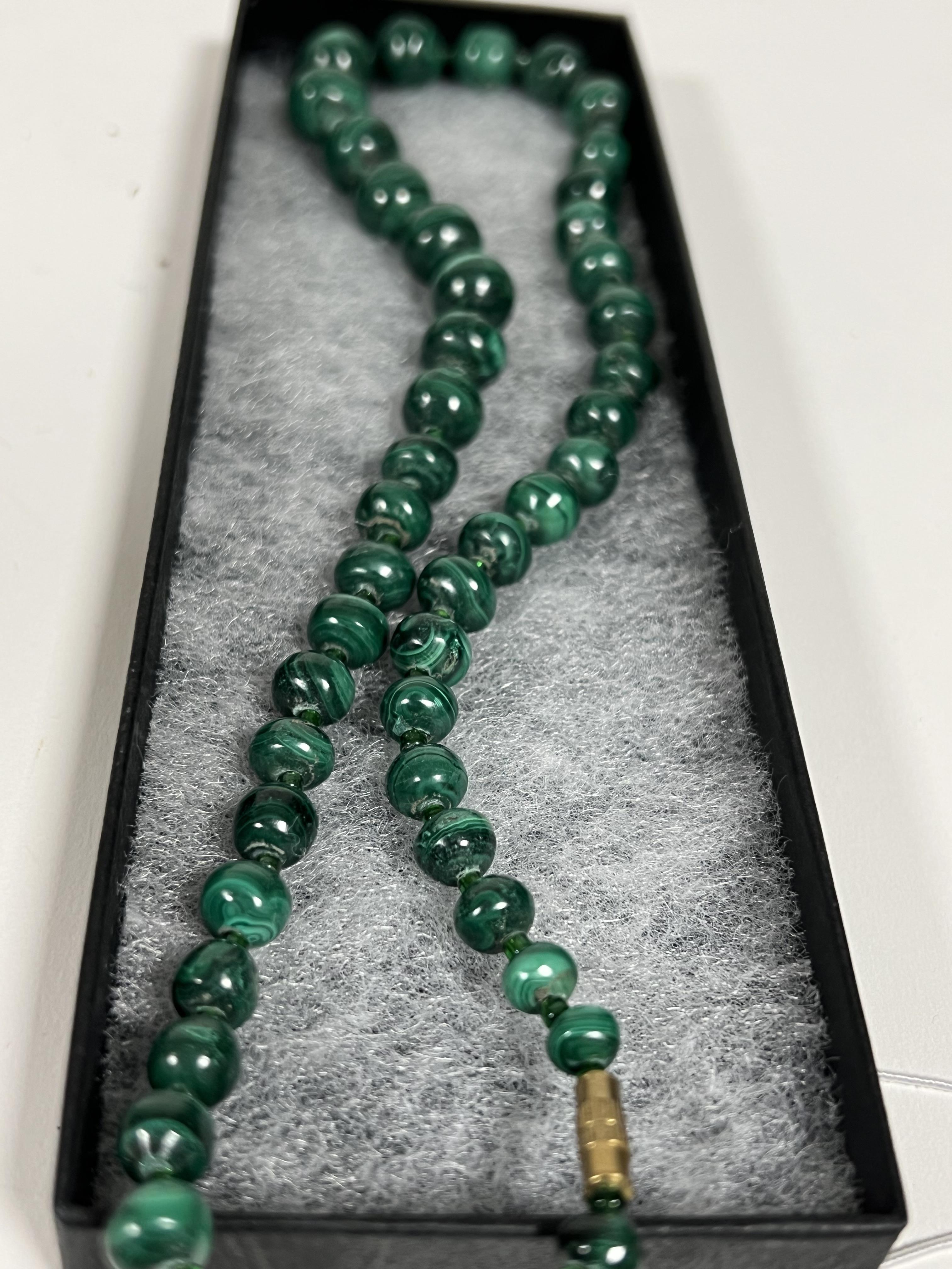 A group of malachite items comprising a beaded necklace, a carved pin dish and a turned egg (3) - Image 2 of 2