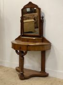 A Victorian mahogany duchess dressing table with swing mirror above a bow front top with two
