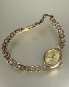 A ladys 9ct gold Sovereign quartz wristwatch of oval design with gilt metal dial on 9ct gold link