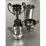 A Birmingham silver miniature two handled cup on moulded plastic stand base has a bump H x 11cm