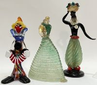 A group of three Italian Murano figures including a clown, a male figure and a female figure in long