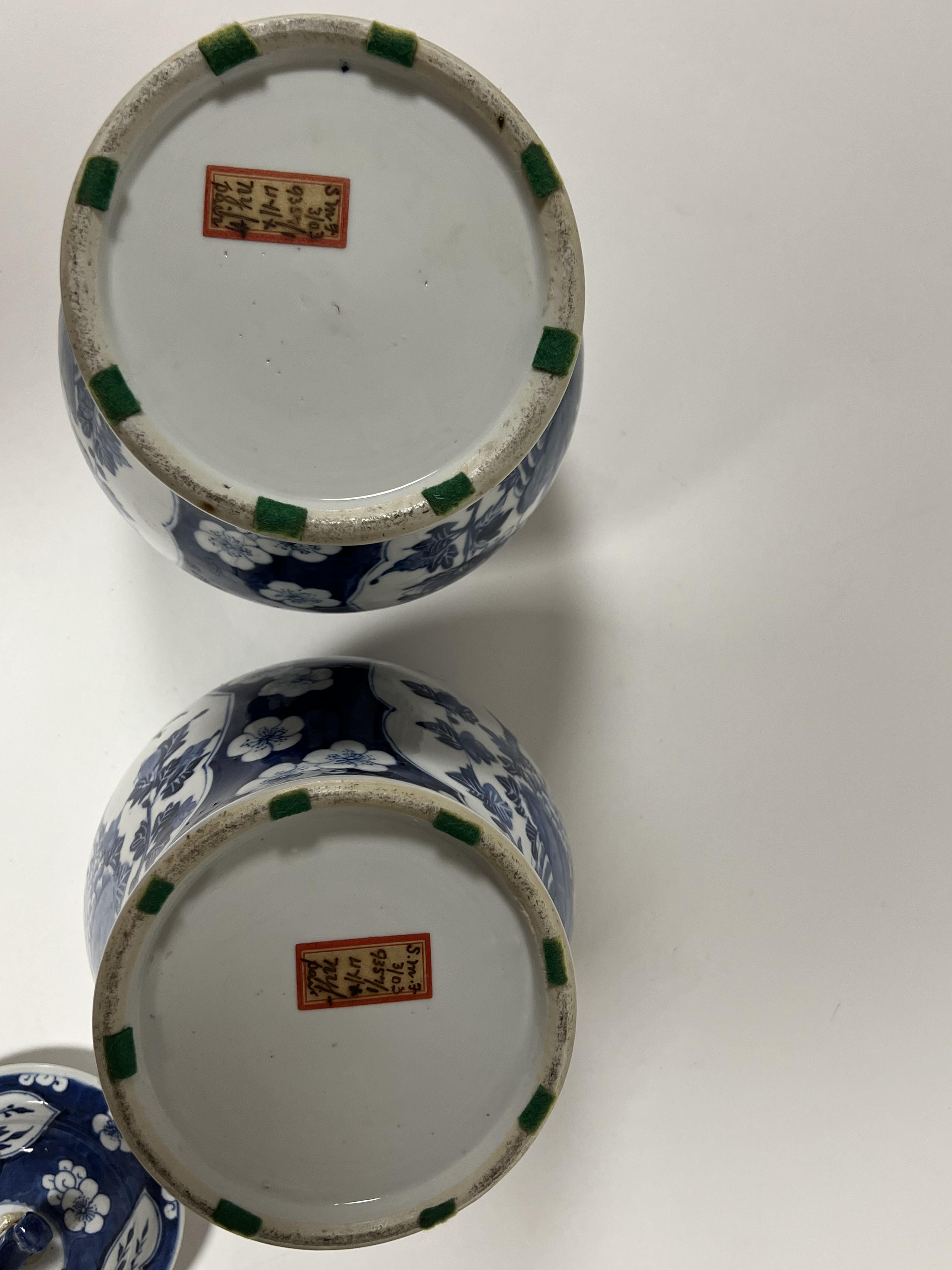 A pair of Chinese blue and white porcelain Kangxi-revival covered vases of baluster form, with panel - Image 2 of 3