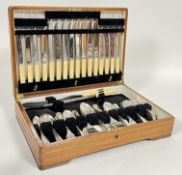 A walnut canteen containing a suite of EPNS Henry Tatton of Edinburgh flatware for six settings
