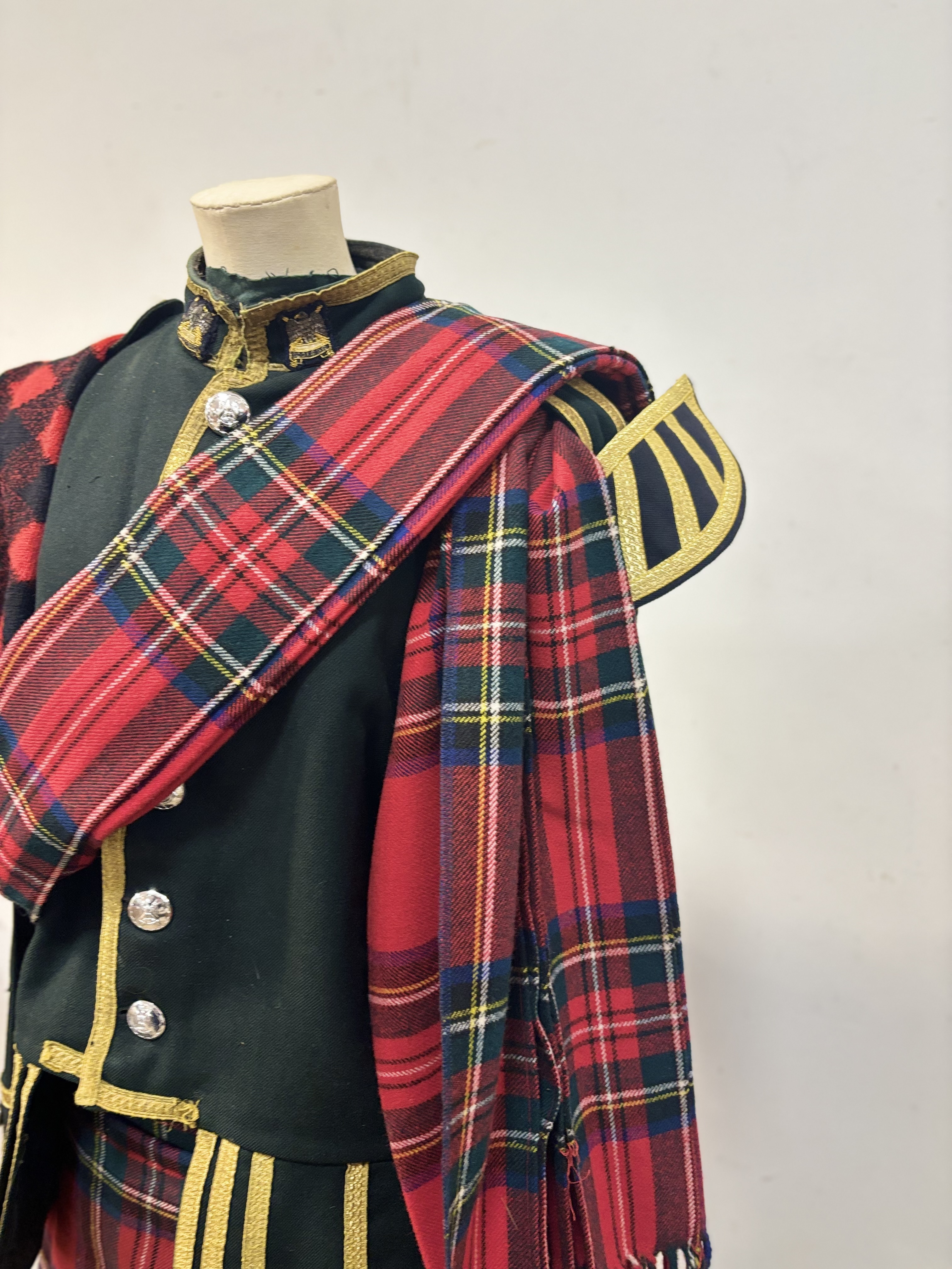 A Royal Scots Dragoon Guards pipes doublet, Royal Stewart kilt and full length plaid, white spats