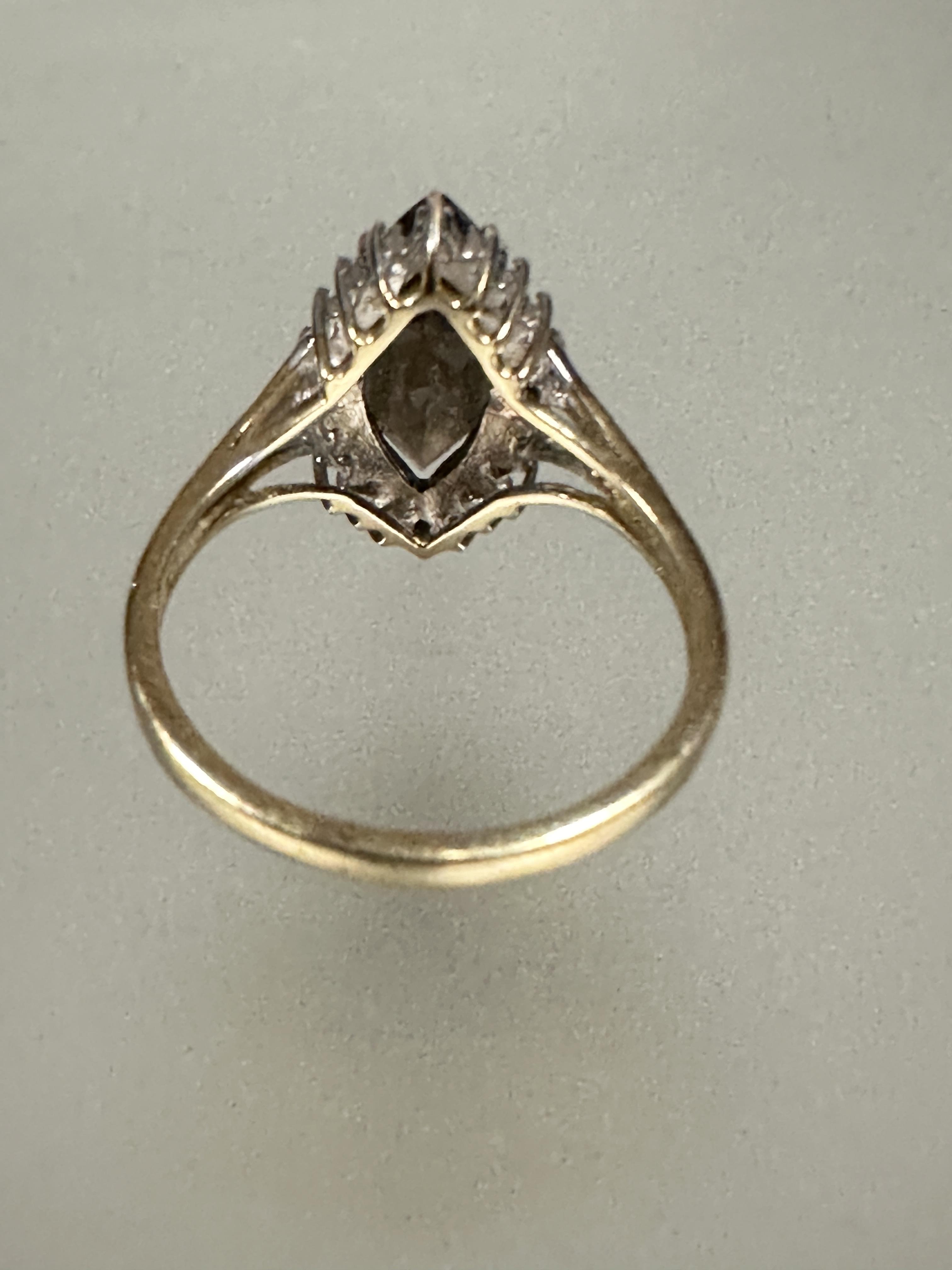 A 9ct gold dress ring set navette shaped cairngorm enclosed within a cz border S 3.57g - Image 3 of 3