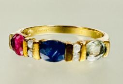 A 9ct gold three stone ring set central oval sapphire flanked by two diamond spacers and a oval
