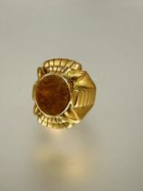 A 1920s Egyptian revival heavy yellow metal signet style cast ring L x 2.5cm W 2cm R 21.94g