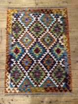 A Chobi kilim flatweave rug of geometric design. 115cm x  85cm .