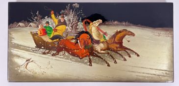 A vintage Russian lacquered wall plaque decorated with figural winter scene of a horse-drawn sleigh,
