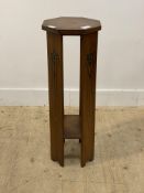 An Art Nouveau period cherry wood jardinière stand, the octagonal top with inlaid cross band
