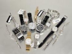 A collection of modern new gents and ladys wristwatches to include three Guess gents watches D x 4.