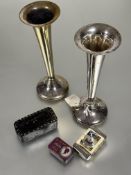 A pair of Epns tapered flower tubes raised on weighted bases H x 18.5cm, a chrome Oban vesta case, a