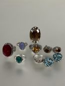 A collection of six various silver rings set citrine, smoky quartz etc and a pair of citrine set