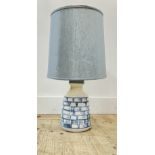 A modern Iden Pottery lamp with abstract blue and white motifs complete with pale blue linen drum