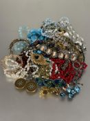A large collection of costume jewellery to include crystal bead necklace, paste pearl necklaces,