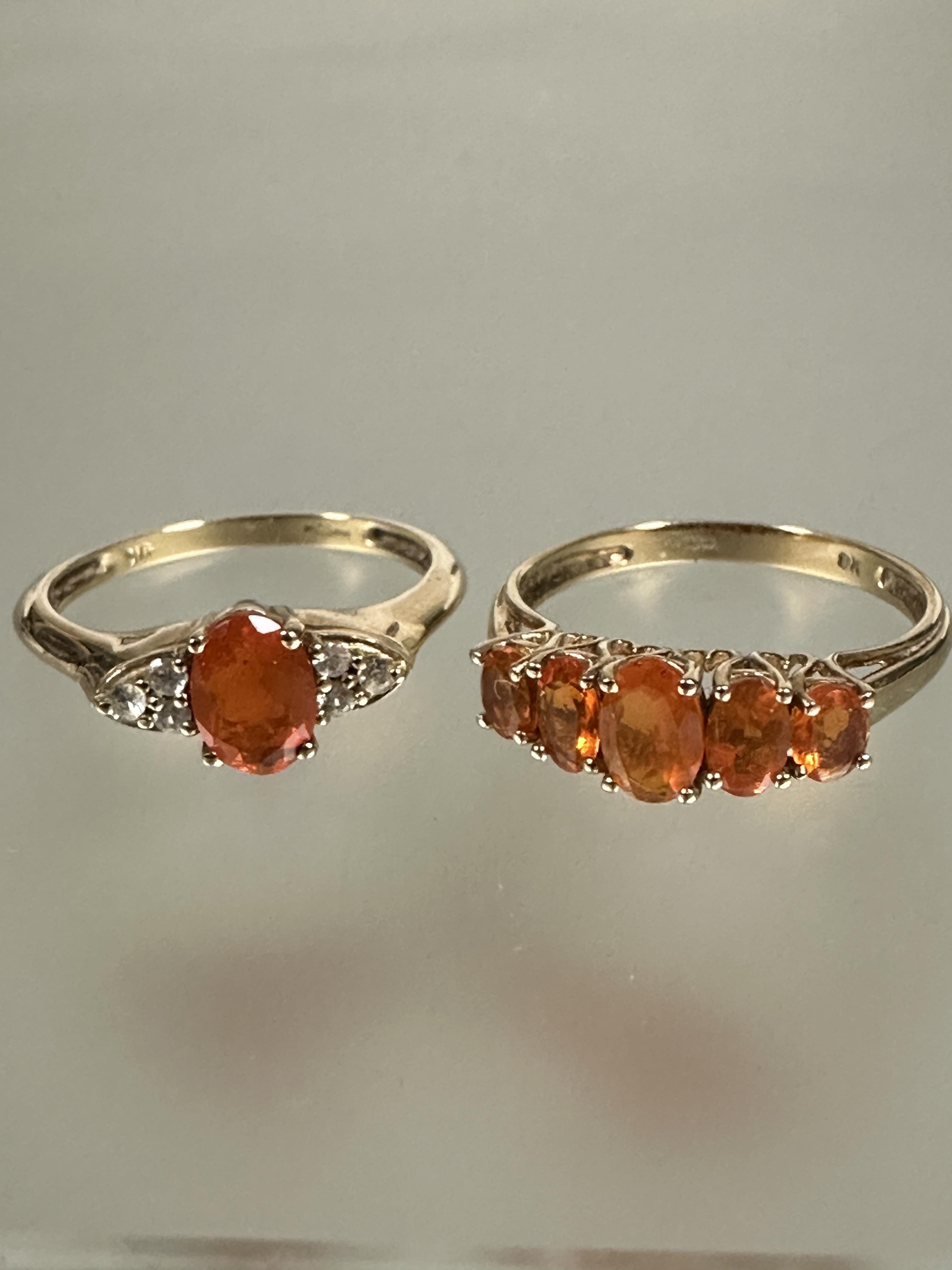 A 9ct gold graduated five amber coloured stone set ring P, a 9ct gold oval amber cut stone ring - Image 2 of 2