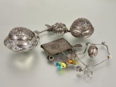 A collection of eastern white metal containers including two hinged all over chased design D x 7cm