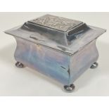 A white metal/silver plated miniature casket, the lid embossed with medieval style town scene (h-