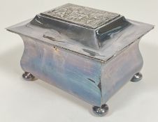 A white metal/silver plated miniature casket, the lid embossed with medieval style town scene (h-