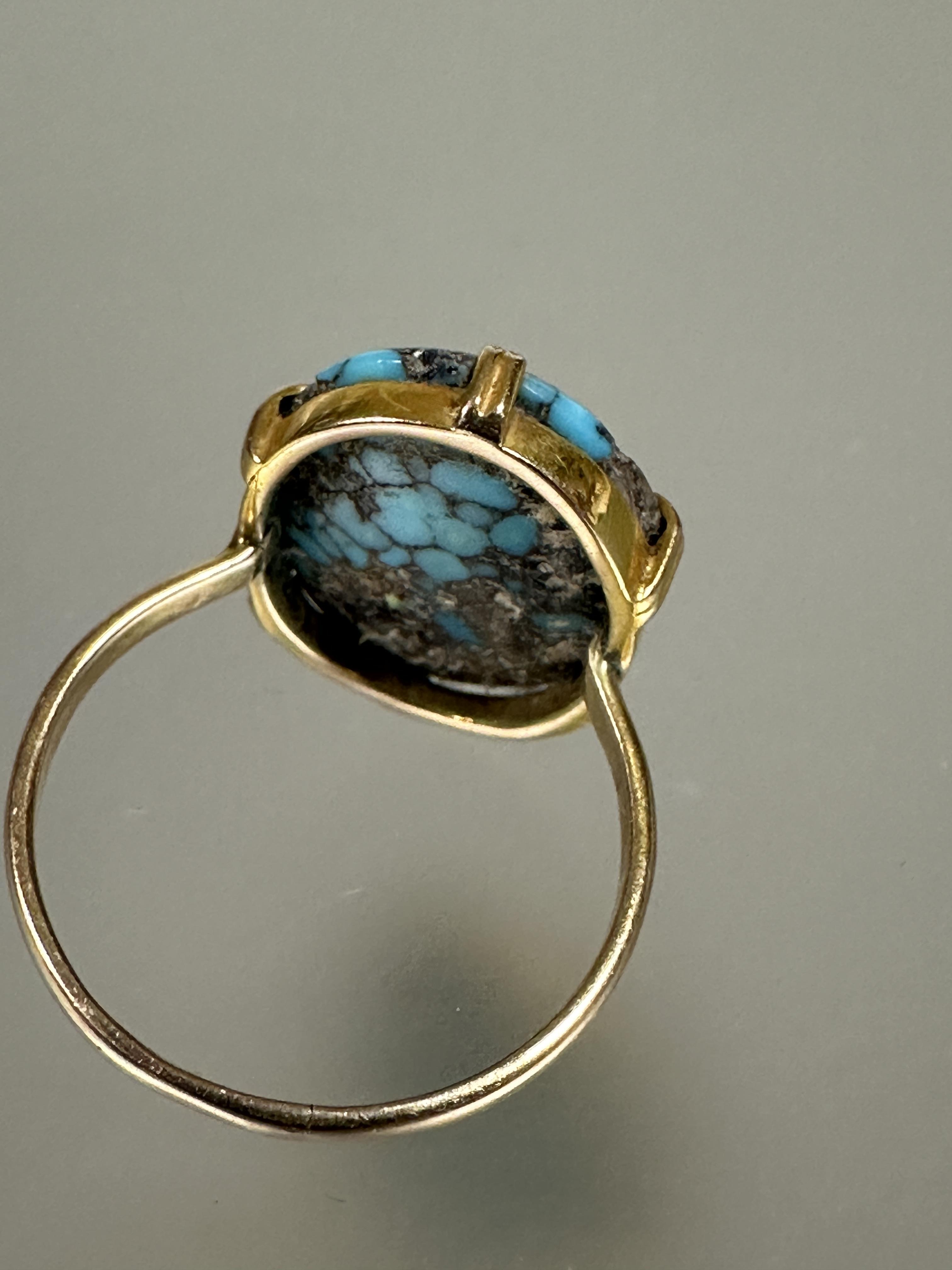 A yellow metal ring set oval turquoise nugget of domed shape mounted in six claw setting T/U L x 2cm - Image 2 of 3