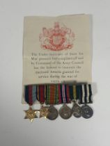 A WW2 group of attributed miniature dress medals, 1939-45 star, Burma Star, Defence and War Medal.