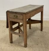 A late 18th / early 19th century country pine drop leaf kitchen table fitted with a drawer to one