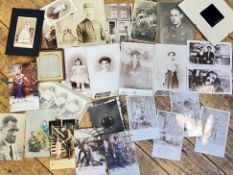 A quantity of antique and vintage photographs and postcards from Great Britain and America including