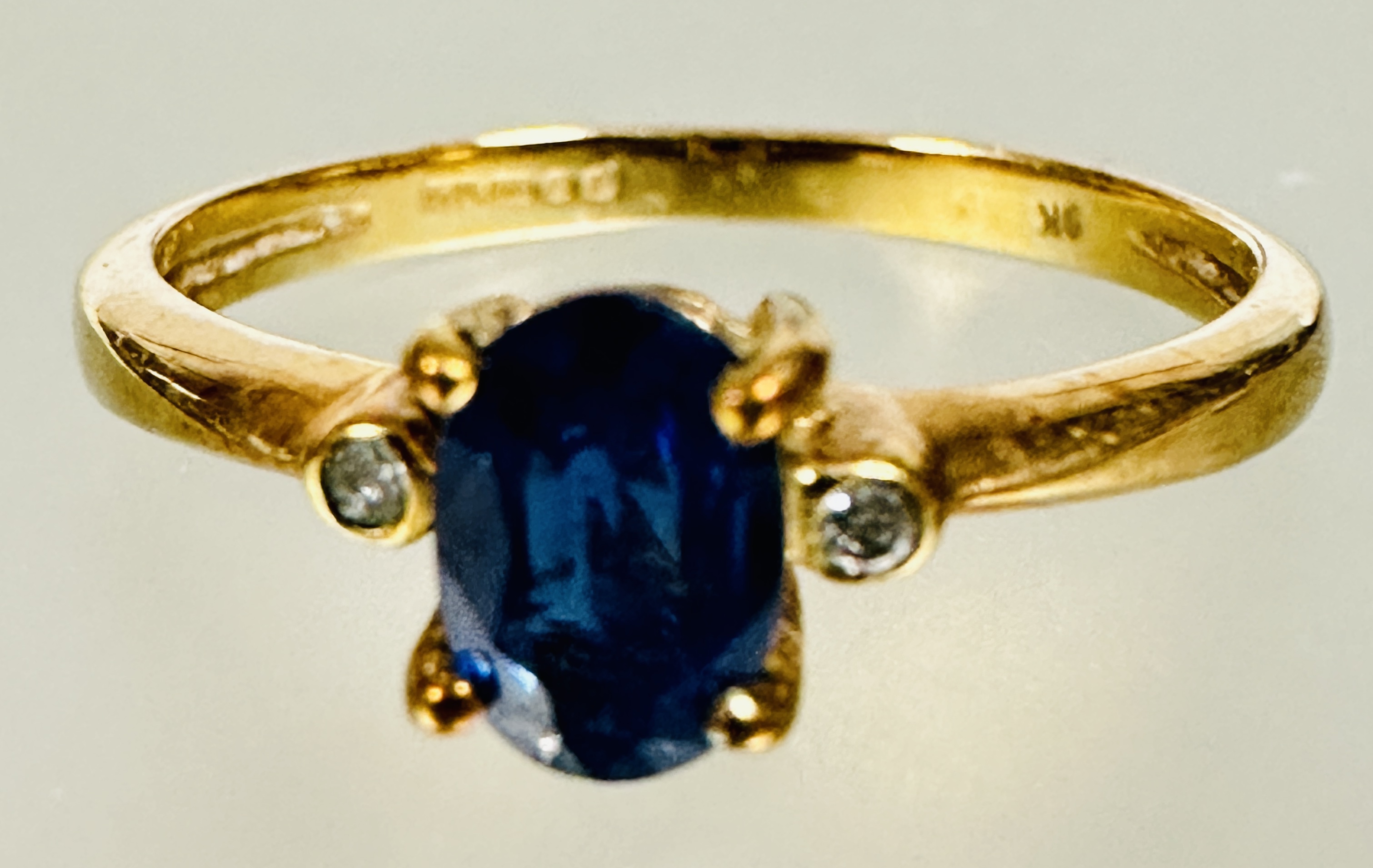A 9ct gold oval sapphire set ring set diamond point to shoulder sapphire approximately 0.2ct N 1.77g - Image 3 of 3