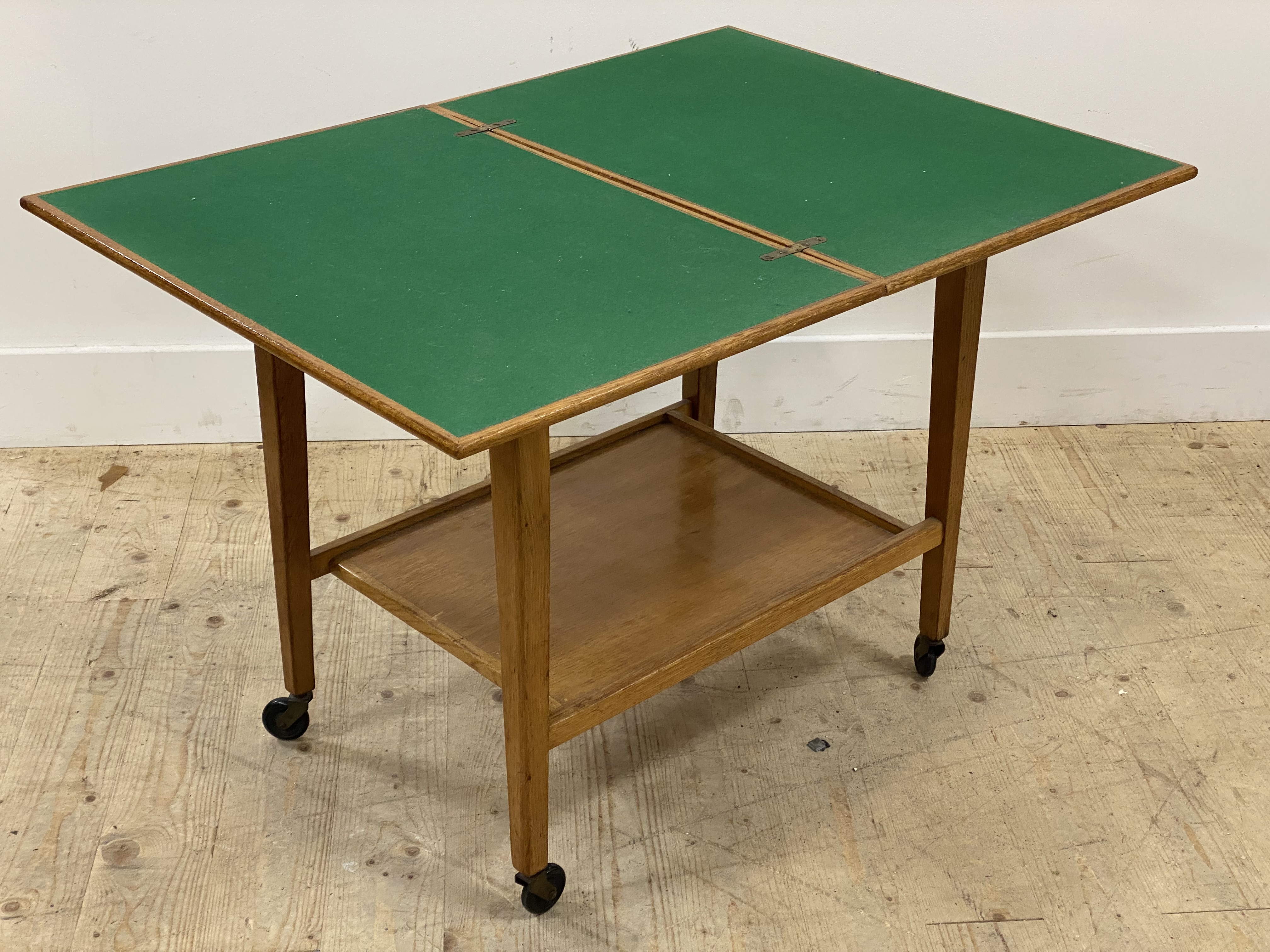 A mid century oak card table, having a fold over revolving top opening to a baize lined playing - Image 2 of 2