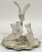 An art glass table centrepiece/epergne in the form of thistles, raised on a mirror base (h- 30cm, w-